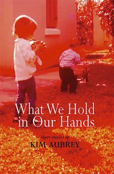 Paperback What We Hold in Our Hands Book