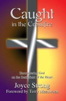 Paperback Caught in the Crossfire: Encountering God on the Battlefield of the Heart Book