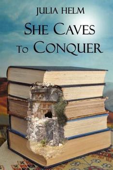 Paperback She Caves To Conquer Book