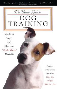 Paperback The Ultimate Guide to Dog Training Book