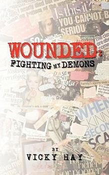 Paperback Wounded: Fighting My Demons Book
