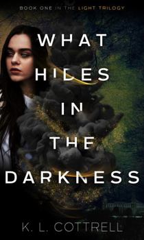 Paperback What Hides in the Darkness Book