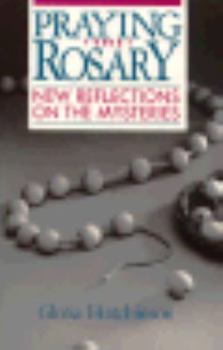 Paperback Praying the Rosary: New Reflections on the Mysteries Book