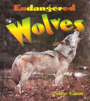 Paperback Endangered Wolves (Earth's Endangered Animals) Book