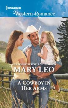 Mass Market Paperback A Cowboy in Her Arms Book