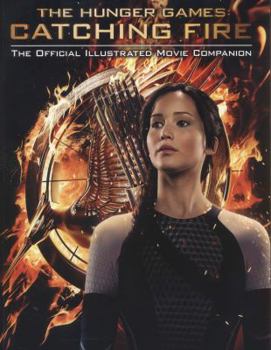 Paperback The Hunger Games: Catching Fire: The Official Illustrated Movie Companion Book