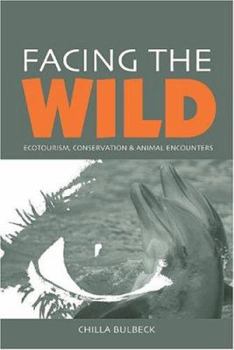 Paperback Facing the Wild: Ecotourism, Conservation and Animal Encounters Book