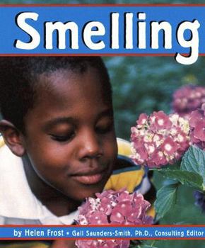 Paperback Smelling (Senses) Book