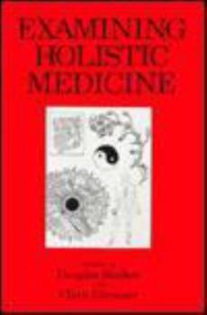 Paperback Examining Holistic Medicine Book