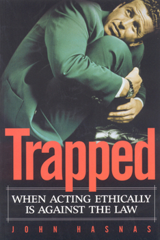 Paperback Trapped: When Acting Ethically Is Against the Law Book