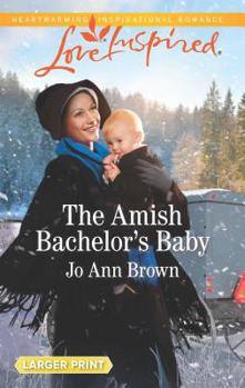 Mass Market Paperback The Amish Bachelor's Baby [Large Print] Book