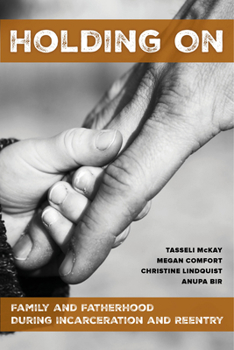 Paperback Holding on: Family and Fatherhood During Incarceration and Reentry Book