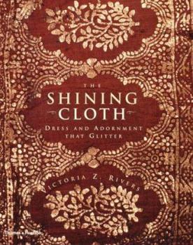 Hardcover The Shining Cloth: Dress and Adornment That Glitter Book