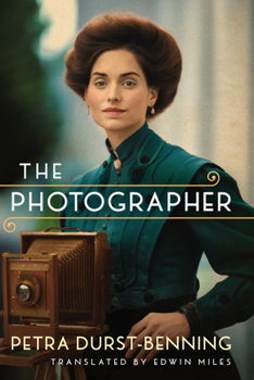 Paperback The Photographer Book