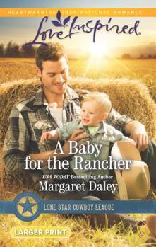 Mass Market Paperback A Baby for the Rancher [Large Print] Book