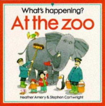 Paperback At the Zoo (What's Happening Series) Book