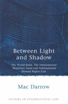 Paperback Between Light and Shadow: The World Bank, the International Monetary Fund and International Human Rights Law Book