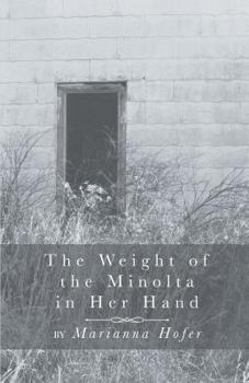 Paperback The Weight of the Minolta in Her Hand Book