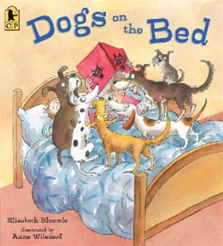 Paperback Dogs on the Bed Book