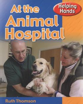 Paperback Helping Hands: At The Animal Hospital Book