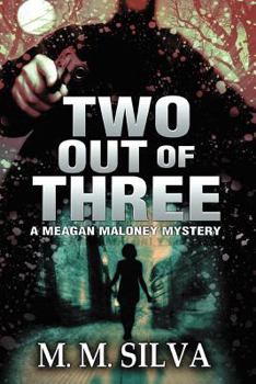 Paperback Two Out of Three: A Meagan Maloney Mystery Book