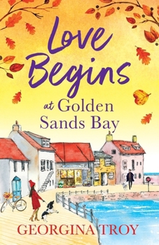 Paperback Love Begins at Golden Sands Bay Book