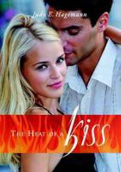 Paperback The Heat of A Kiss Book