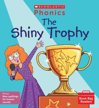 Paperback The Shiny Trophy (Set 11) (Phonics Book Bag Readers) Book