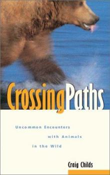 Paperback Crossing Paths: Uncommon Encounters with Animals in the Wild Book