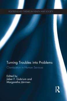 Paperback Turning Troubles Into Problems: Clientization in Human Services Book