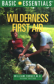 Paperback Basic Essentials Wilderness First Aid, 2nd Book