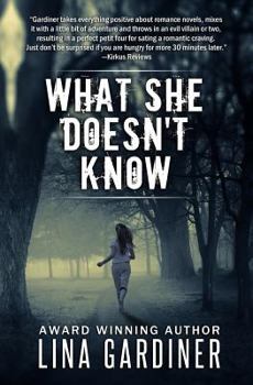 Paperback What She Doesn't Know Book