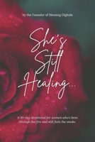 She’s Still Healing...: A 30-day devotional for women who’s been through the fire and still feels the smoke. B0FSLDHWQ1 Book Cover