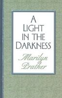 A Light in the Darkness (Avalon Mysteries) 0786254653 Book Cover