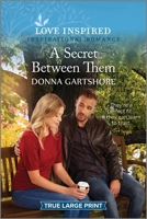 A Secret Between Them: An Uplifting Inspirational Romance (Love Inspired 1335417915 Book Cover
