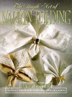 The Simple Art of Napkin Folding: 94 Fancy Folds for Every Tabletop Occasion 0688102808 Book Cover