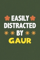 Easily Distracted By Gaur: Gaur Lovers Funny Gifts Dot Grid Journal Notebook 6x9 120 Pages 1679759752 Book Cover