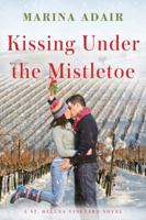 Kissing Under the Mistletoe 1612185851 Book Cover