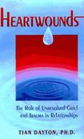 Heartwounds: The Impact of Unresolved Trauma and Grief on Relationships 1558745106 Book Cover