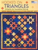 Hooked on Triangles: 19 Quilts for Foundation Piecing (That Patchwork Place) 1564775461 Book Cover