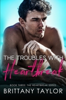 The Troubles with Heartbreak: A Fake Engagement Sports Romance B0BHT2LDD6 Book Cover