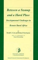 Between a Swamp and a Hard Place: Developmental Challenges in Remote Rural Africa (Harvard Studies in International Development) 0674068610 Book Cover