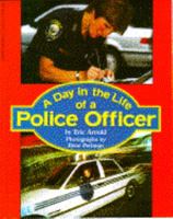 A Day in the Life of a Police Officer 059047443X Book Cover