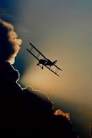 BIPLANE SILHOUETTE: A fixed-wing aircraft with two main wings stacked one above the other. The first powered, controlled airplane to fly, the Wright ... many aircraft in the early years of aviation. 1798246937 Book Cover