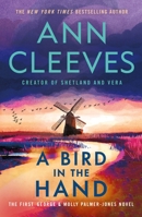 A Bird in the Hand: The First George & Molly Palmer-Jones Novel (George & Molly Palmer-Jones Series, 1) 1250389852 Book Cover