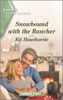 Snowbound with the Rancher: A Clean and Uplifting Romance 1335584684 Book Cover