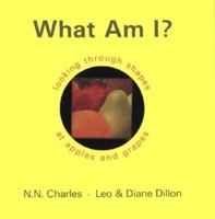What Am I?: Looking Through Shapes at Apples and Grapes 0590478915 Book Cover