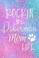 Rockin This Doberman Mom Life: Doberman Pinscher Dog Notebook Journal for Dog Moms with Cute Dog Paw Print Pages Great Notepad for Shopping Lists, Daily Diary, To Do List, Dog Mom Gifts or Present for 1697469825 Book Cover