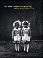 Between Dogs And Wolves: Growing Up With South Africa 1904587321 Book Cover