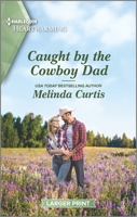 Caught by the Cowboy Dad: A Clean Romance 1335179909 Book Cover
